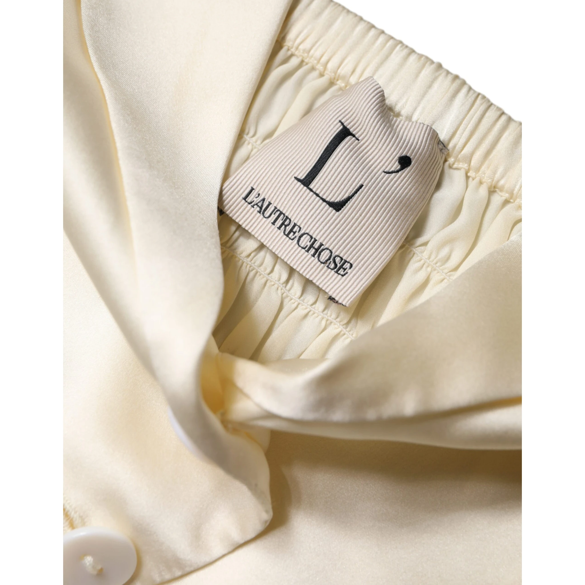 Off White Silk Sleeveless Buttoned Halter Top