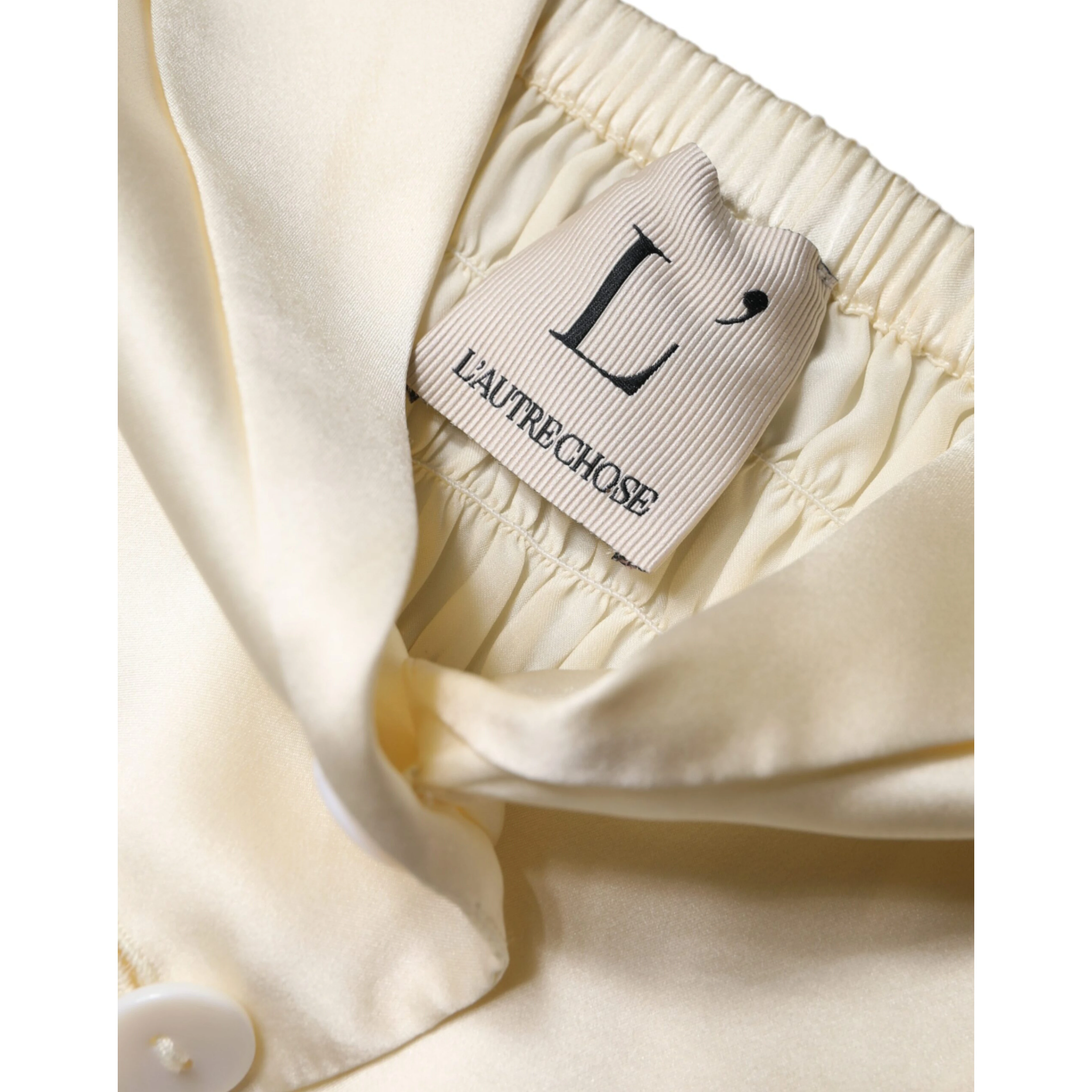 Off White Silk Sleeveless Buttoned Halter Top