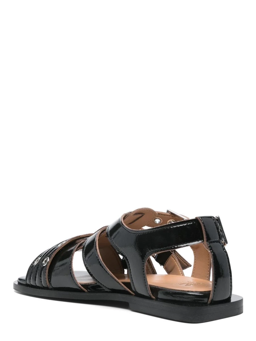 Ganni Buckle Sandals With Flat Sole And Metal Eyelets In Black