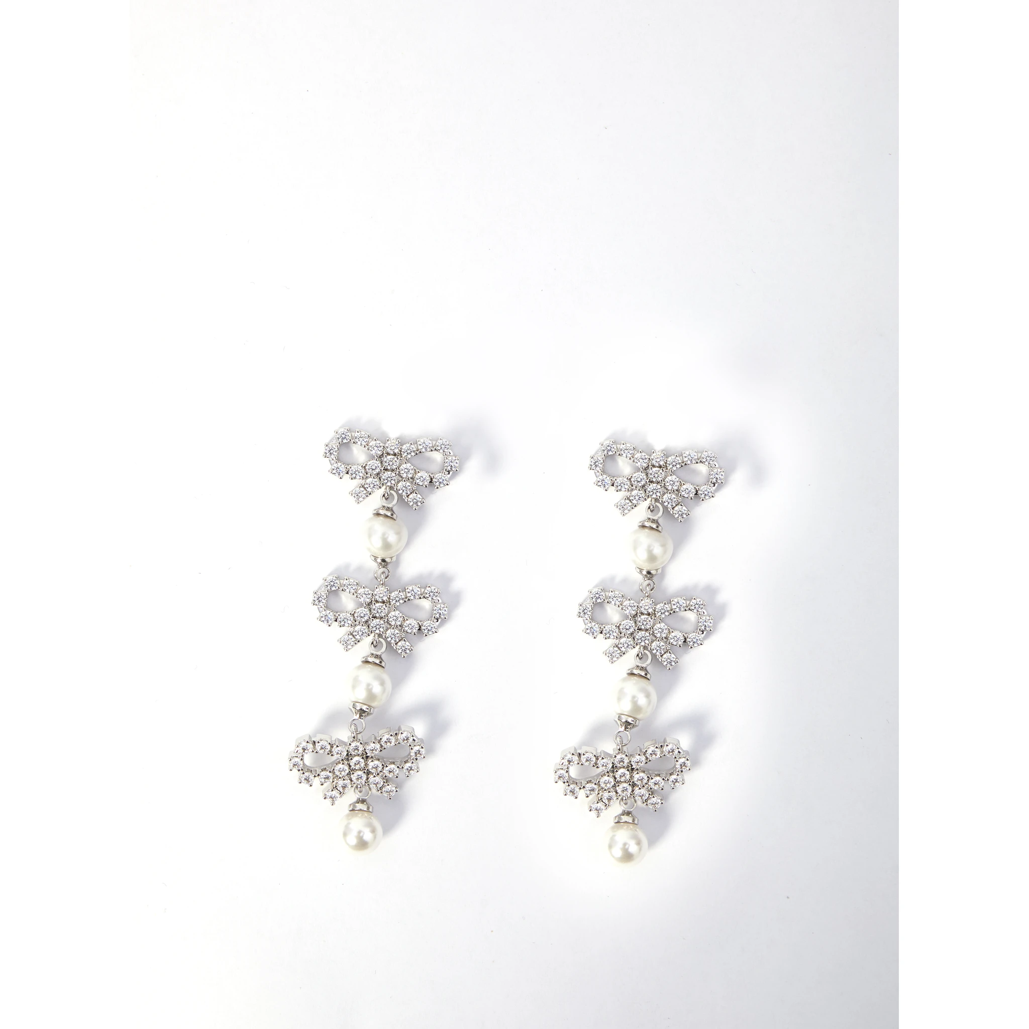 Micro bow pearl tiered earrings