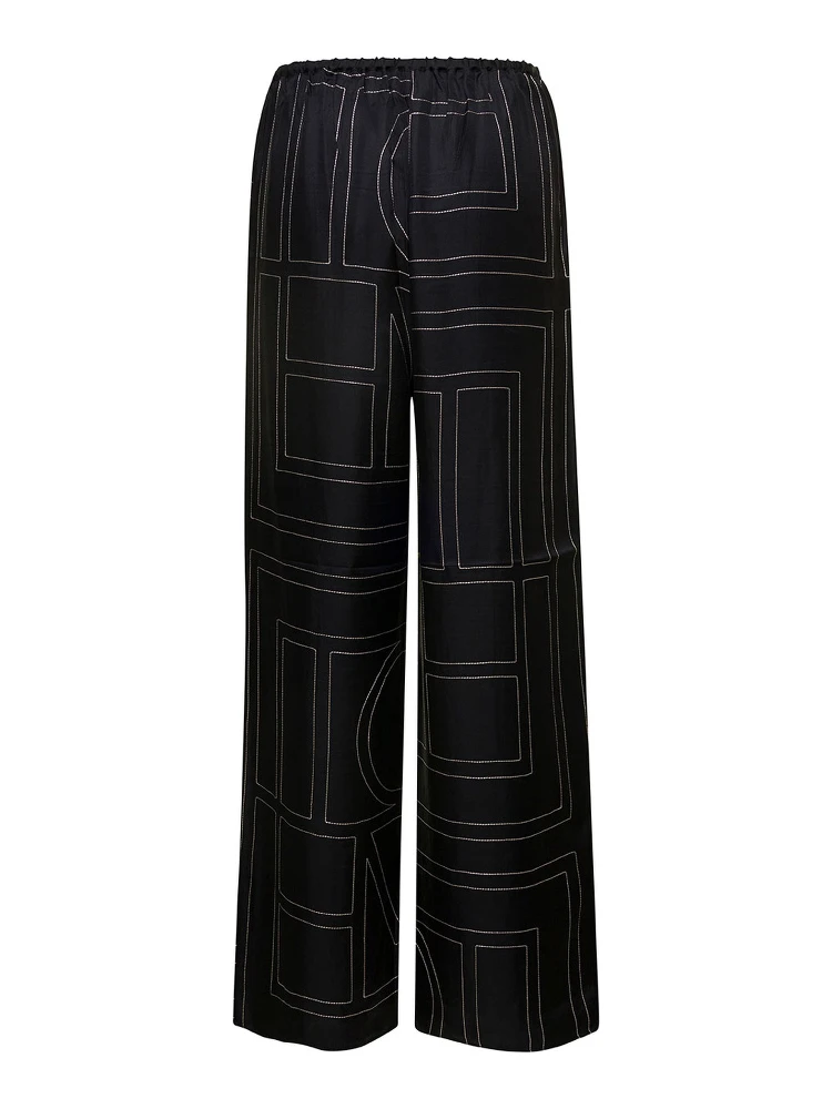 Black Loose Pants with Monogram Print in Silk Woman alternative