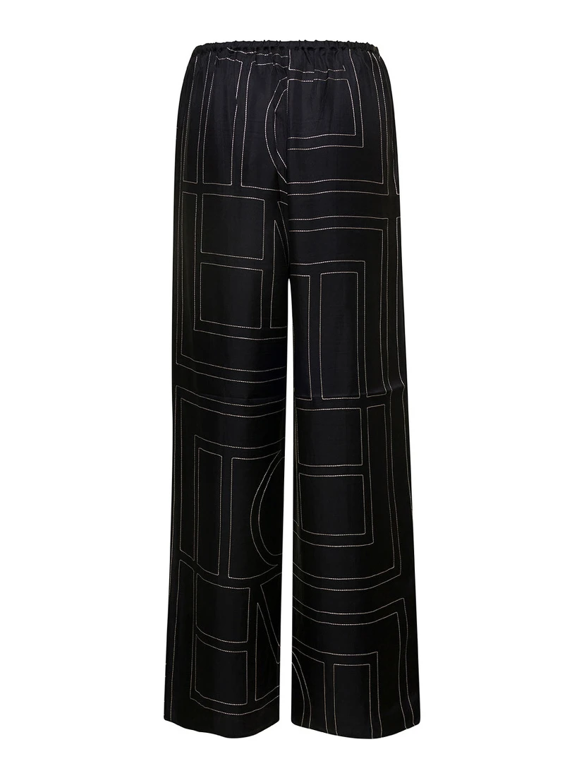 Black Loose Pants with Monogram Print in Silk Woman