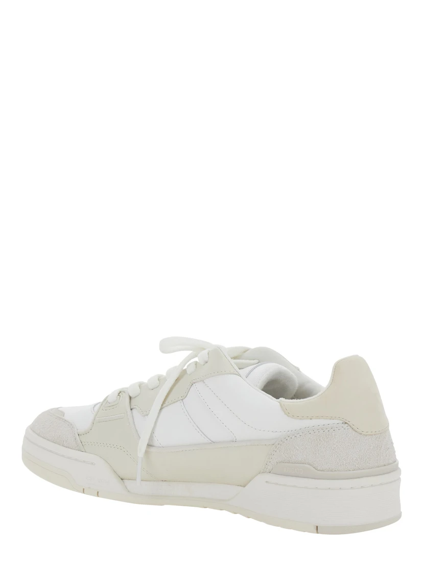 حذاء رياضي بيج طيني مع أجزاء من الجلد المدبوغ وشعار على اللسان من الجلد الرجالي