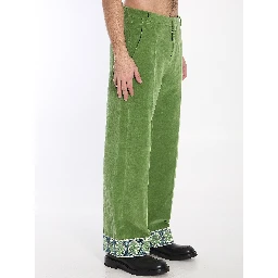 Velvet trousers with jacquard hems