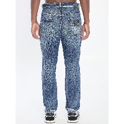 Denim pants with plaque