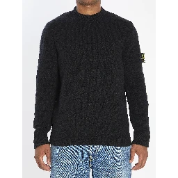 Crew neck sweater with brushed texture.