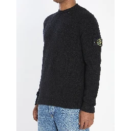 Crew neck sweater with brushed texture.