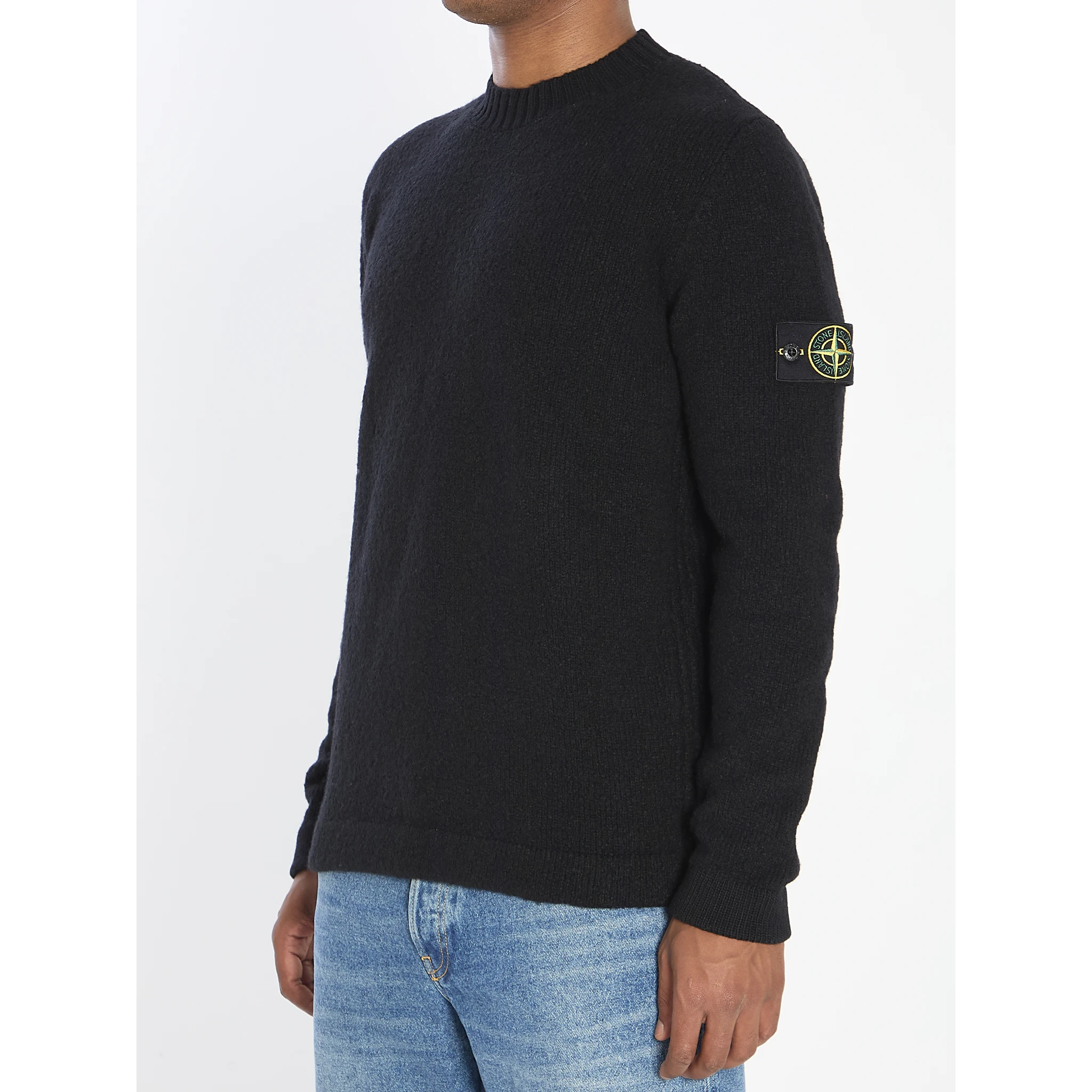 Crew neck sweater with brushed texture.