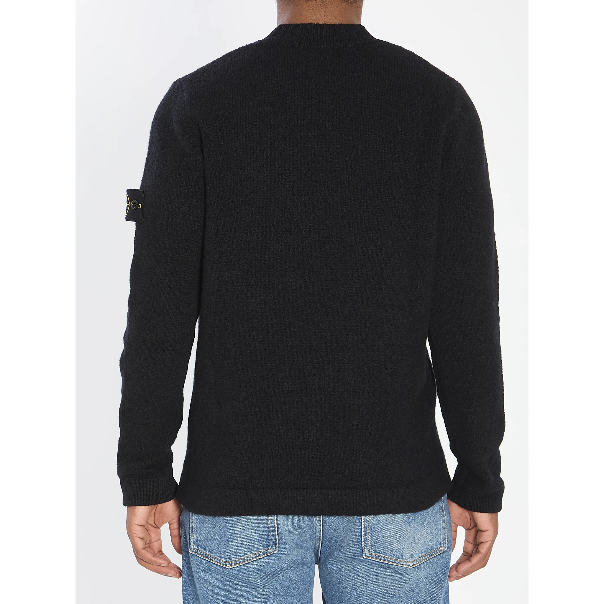 Crew neck sweater with brushed texture.