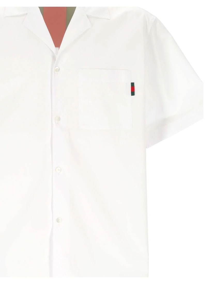 قمصان غوتشي بيضاء