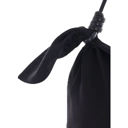 فستان أسود واسع بدون أكمام بياقة هالتر مزين بفيونكة