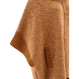 Cape with fur inserts
