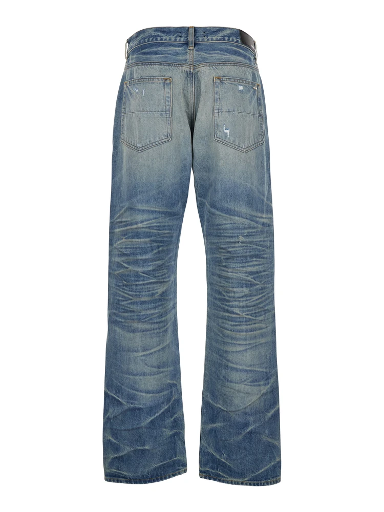 Blue Jeans with Ripped Details on the Front and Logo Patch on the Rear in Denim Man alternative