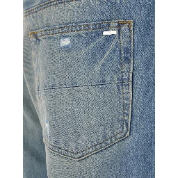 Blue Jeans with Ripped Details on the Front and Logo Patch on the Rear in Denim Man