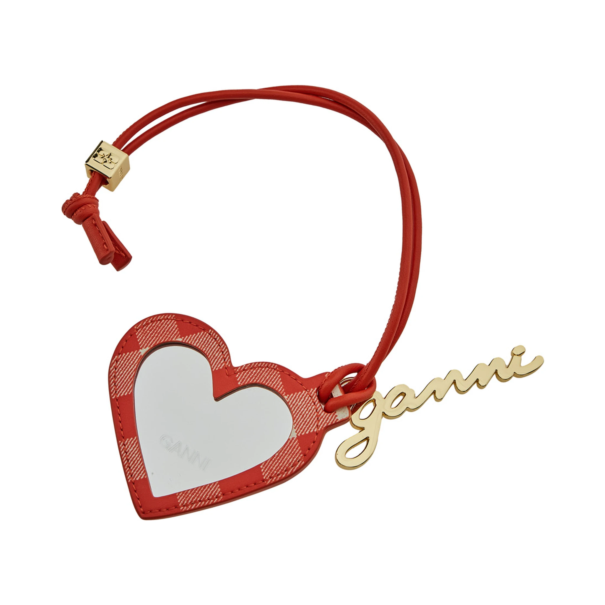 مرآة حمراء على شكل قلب مزينة بشعار مكتوب، مصنوعة من قماش تقني وجلد نسائي