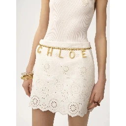 Metallic Belt with Adjustable Hook Closure and Logo Lettering Charm in Brass Woman