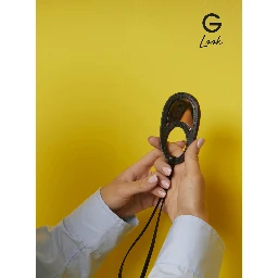 Black Charm with Built-In Mirror and Logo Lettering on the Front in Leather Woman