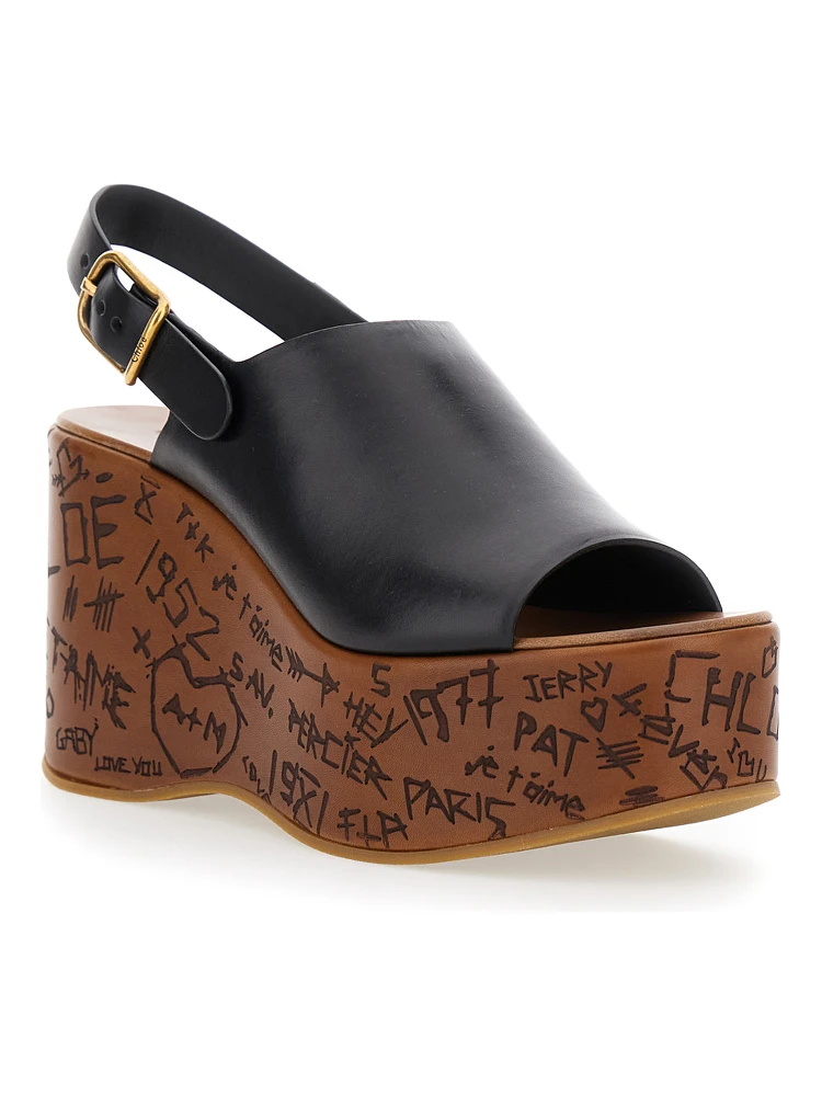 Maxime Black Wedge with Engraved Written Decorations and Logo Buckle in Leather Woman alternative