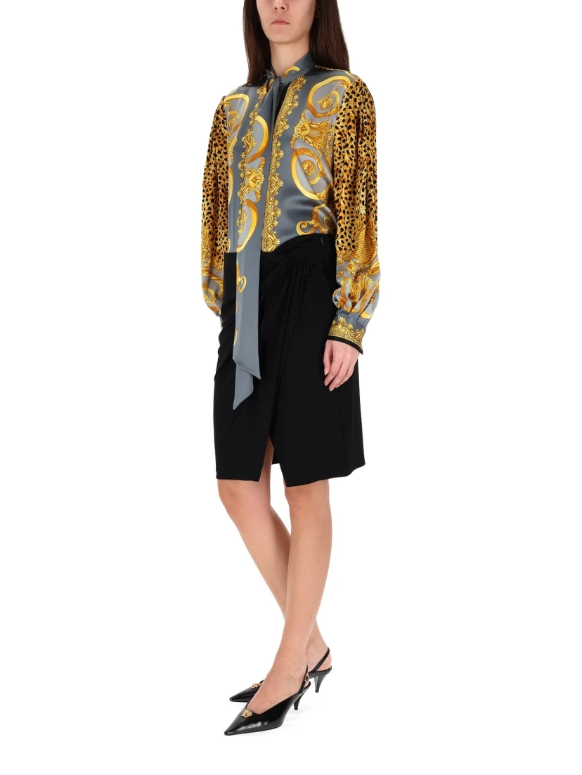 MIDI SKIRT WITH ASYMMETRICAL HEMLINE