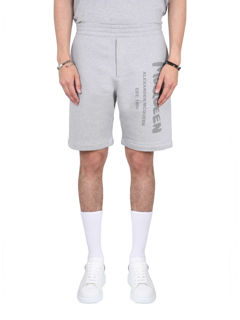 BERMUDA SHORTS WITH GRAFFITI LOGO PRINT