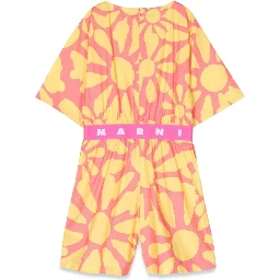 mc jumpsuit and patterned shorts