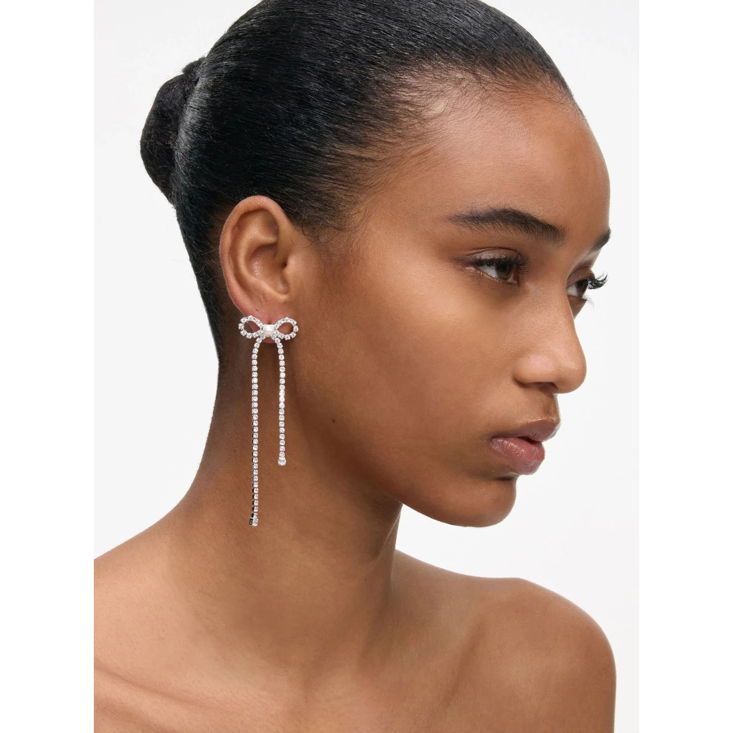 Silver Colored Pendant Earings with Bow Detail and all-Over Crystal Embellishments in Copper Woman