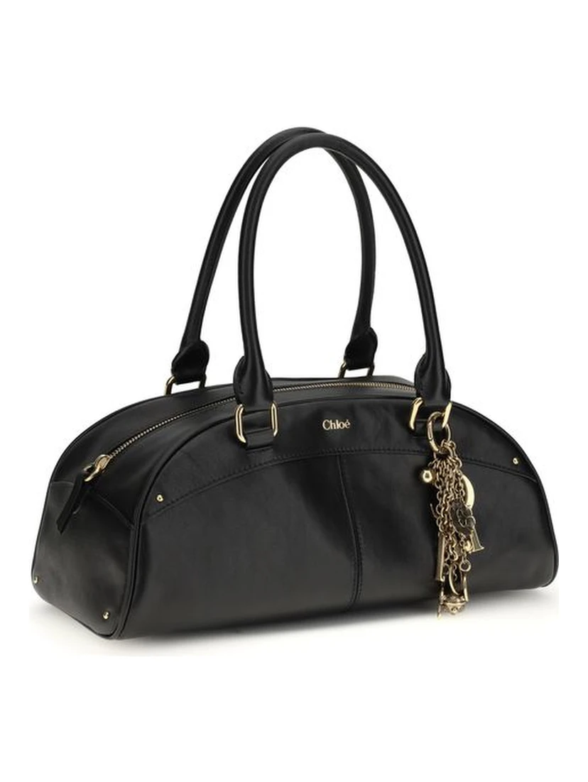 حقيبة كتف بوس توروس من جلد العجل الأسود