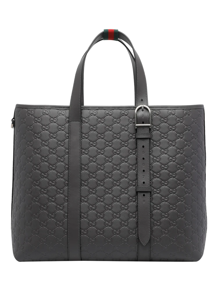 حقيبة تسوق كبيرة رمادية داكنة اللون مزينة بشعار GG