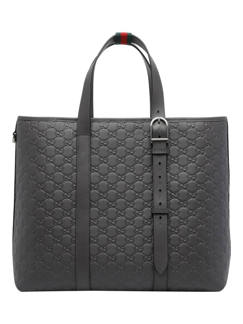 حقيبة تسوق كبيرة رمادية داكنة اللون مزينة بشعار GG