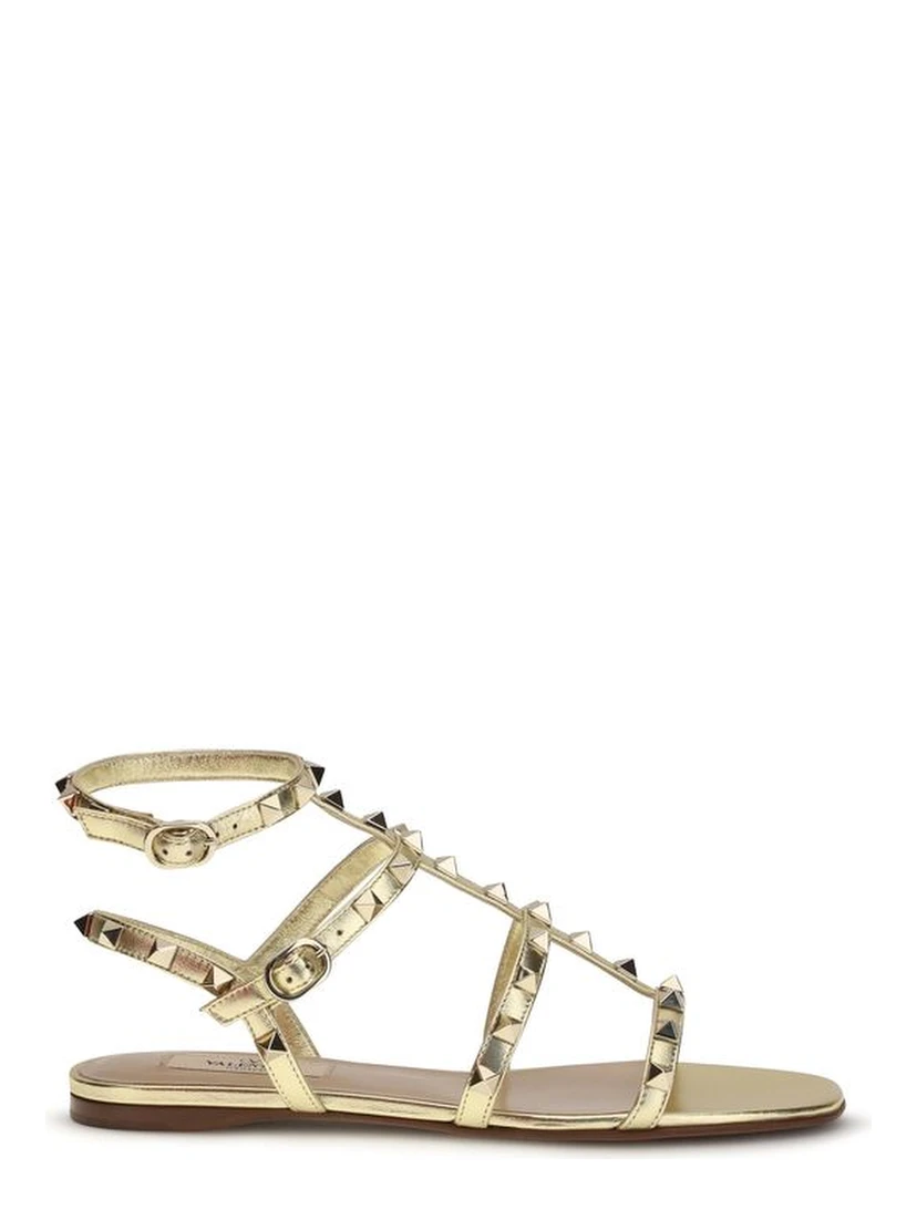 صندل مسطح من جلد العجل الذهبي من بوس توروس