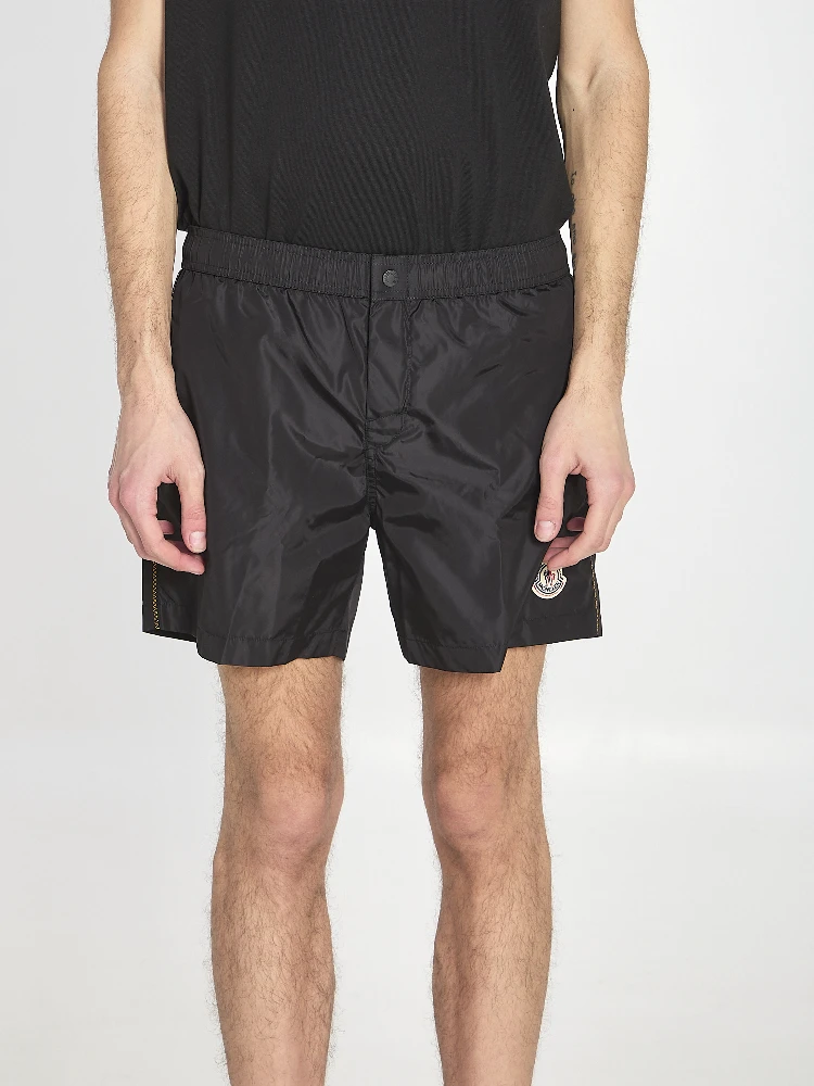 Swim shorts with a logo patch