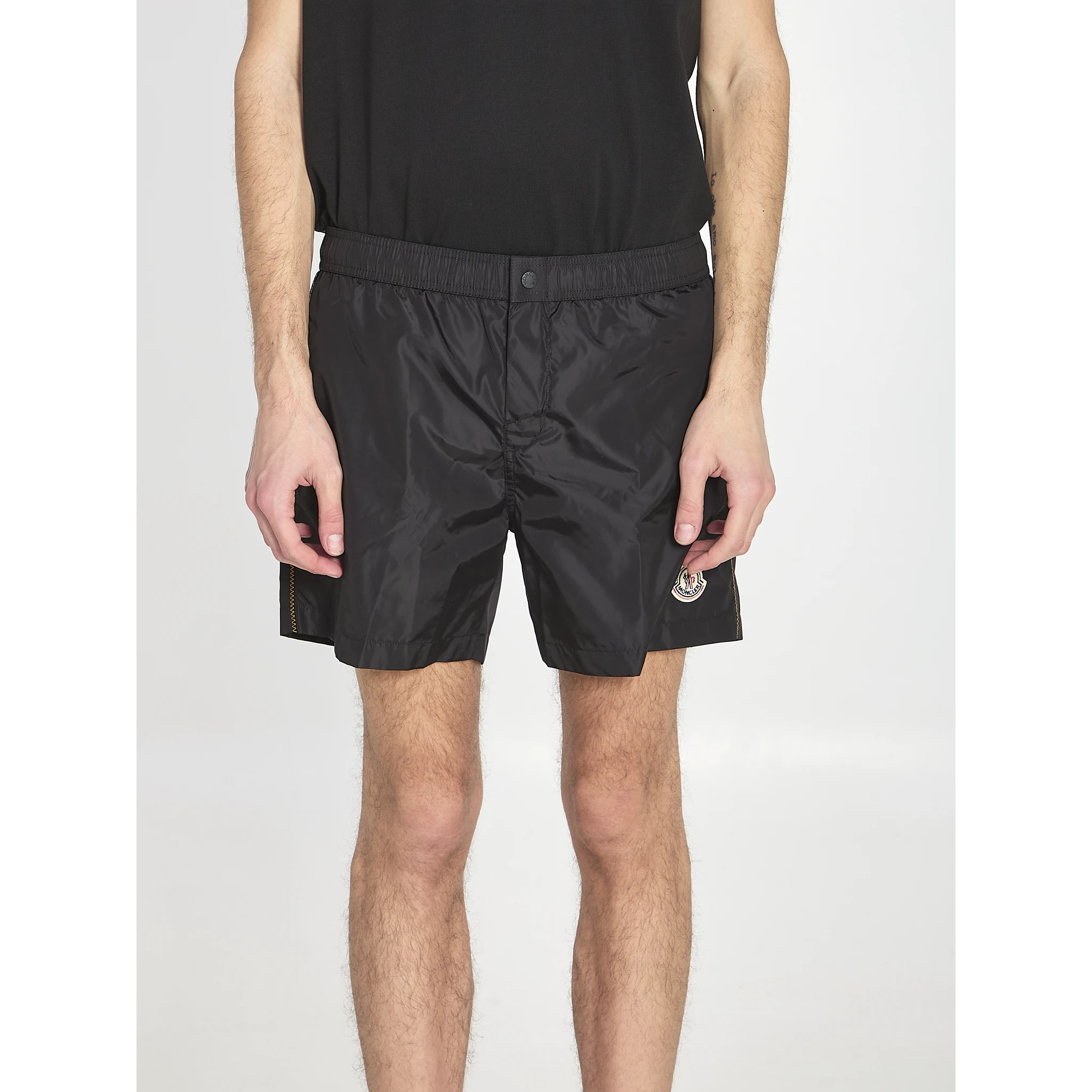 Swim shorts with a logo patch