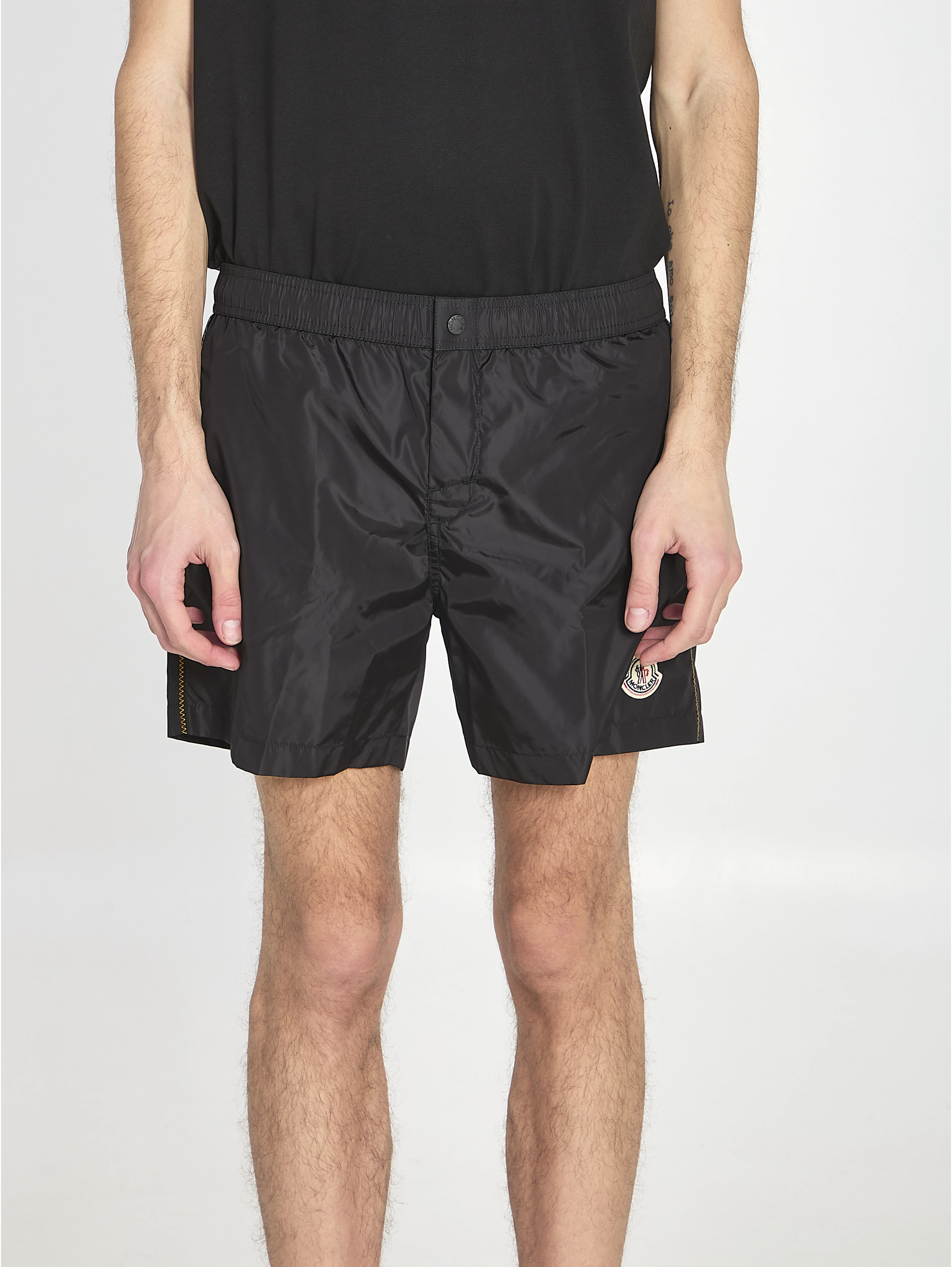 Swim shorts with a logo patch