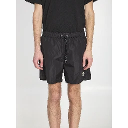 Swim shorts with a logo patch