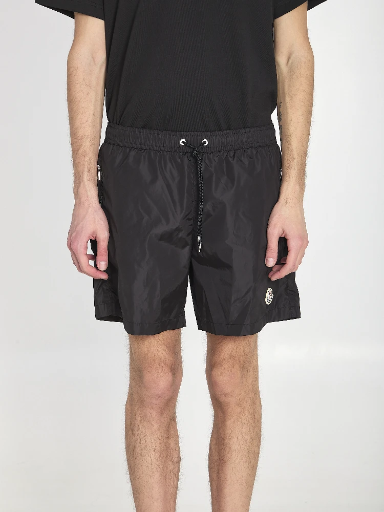 Swim shorts with a logo patch