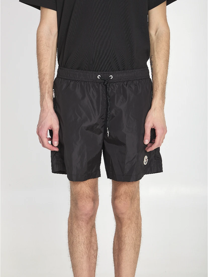 Swim shorts with a logo patch