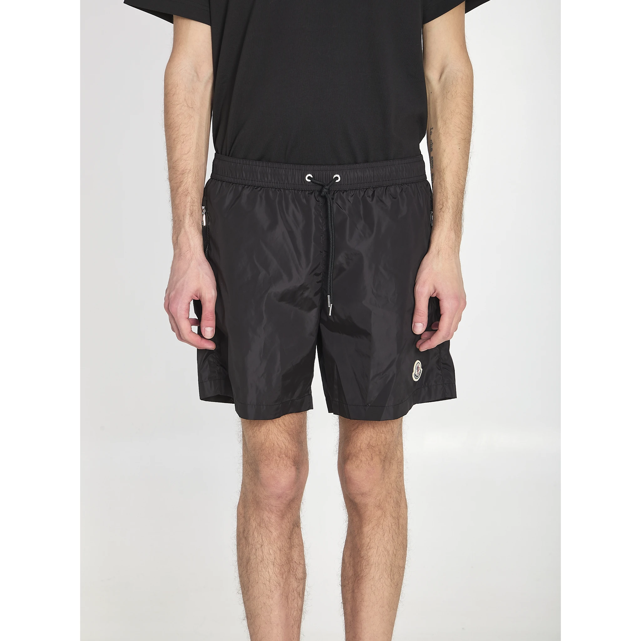 Swim shorts with a logo patch