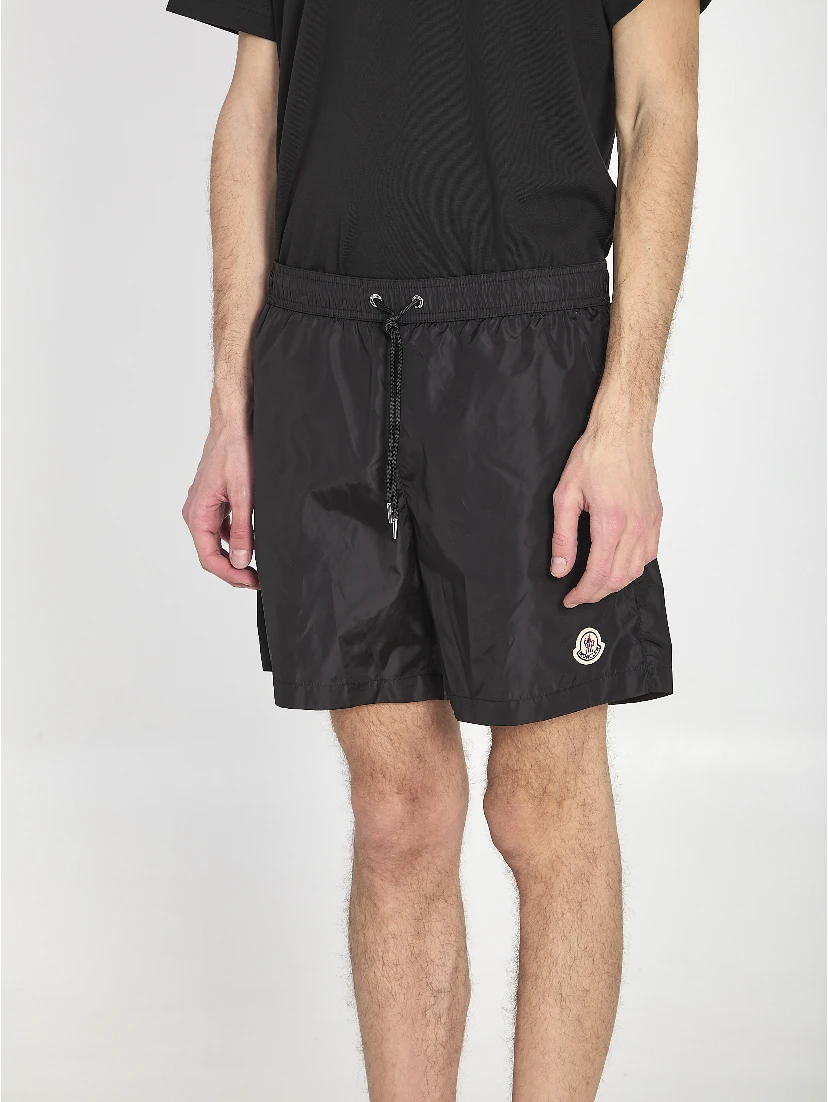 Swim shorts with a logo patch