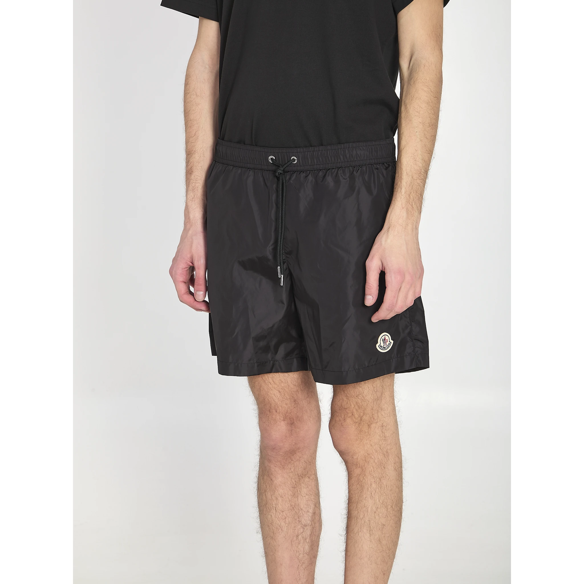 Swim shorts with a logo patch