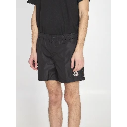 Swim shorts with a logo patch