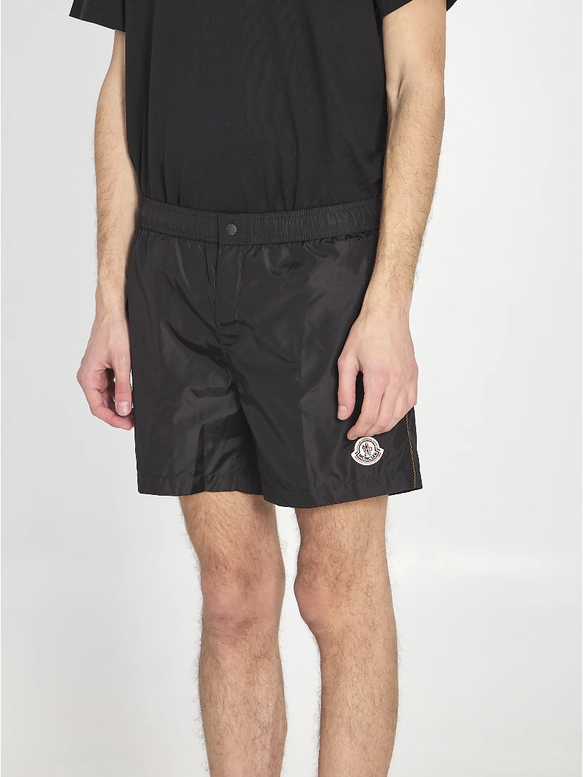 Swim shorts with a logo patch