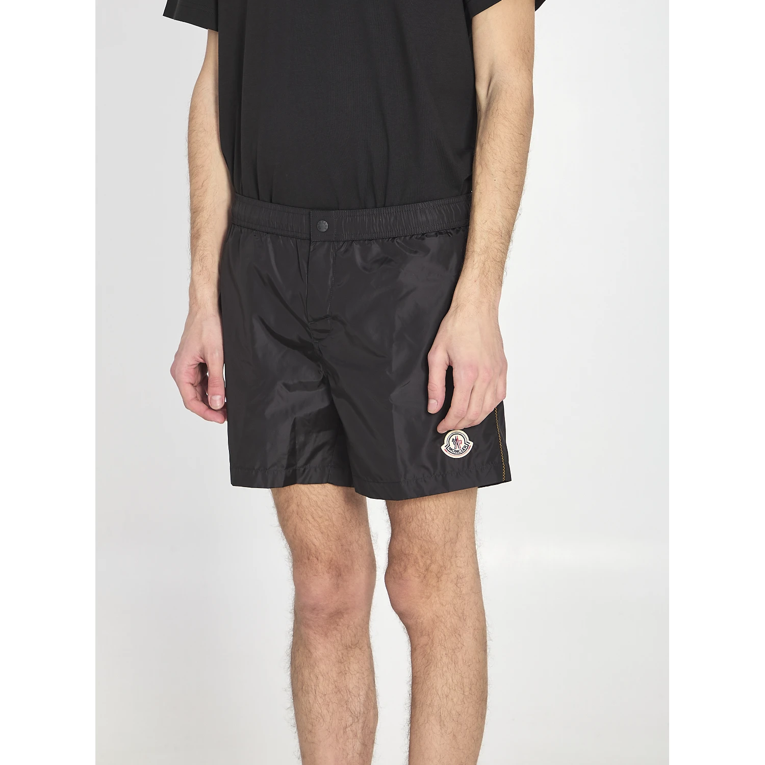 Swim shorts with a logo patch