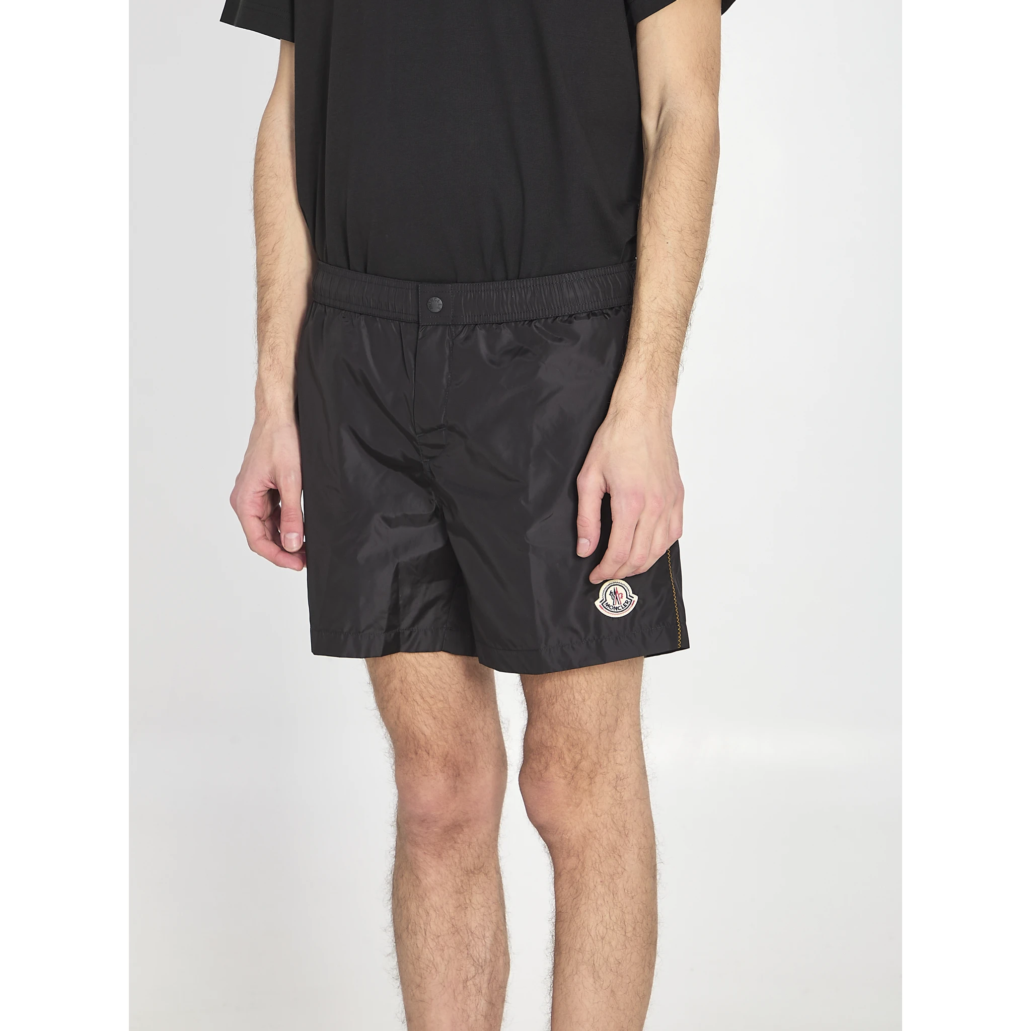 Swim shorts with a logo patch
