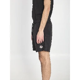 Swim shorts with a logo patch
