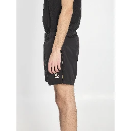 Swim shorts with a logo patch