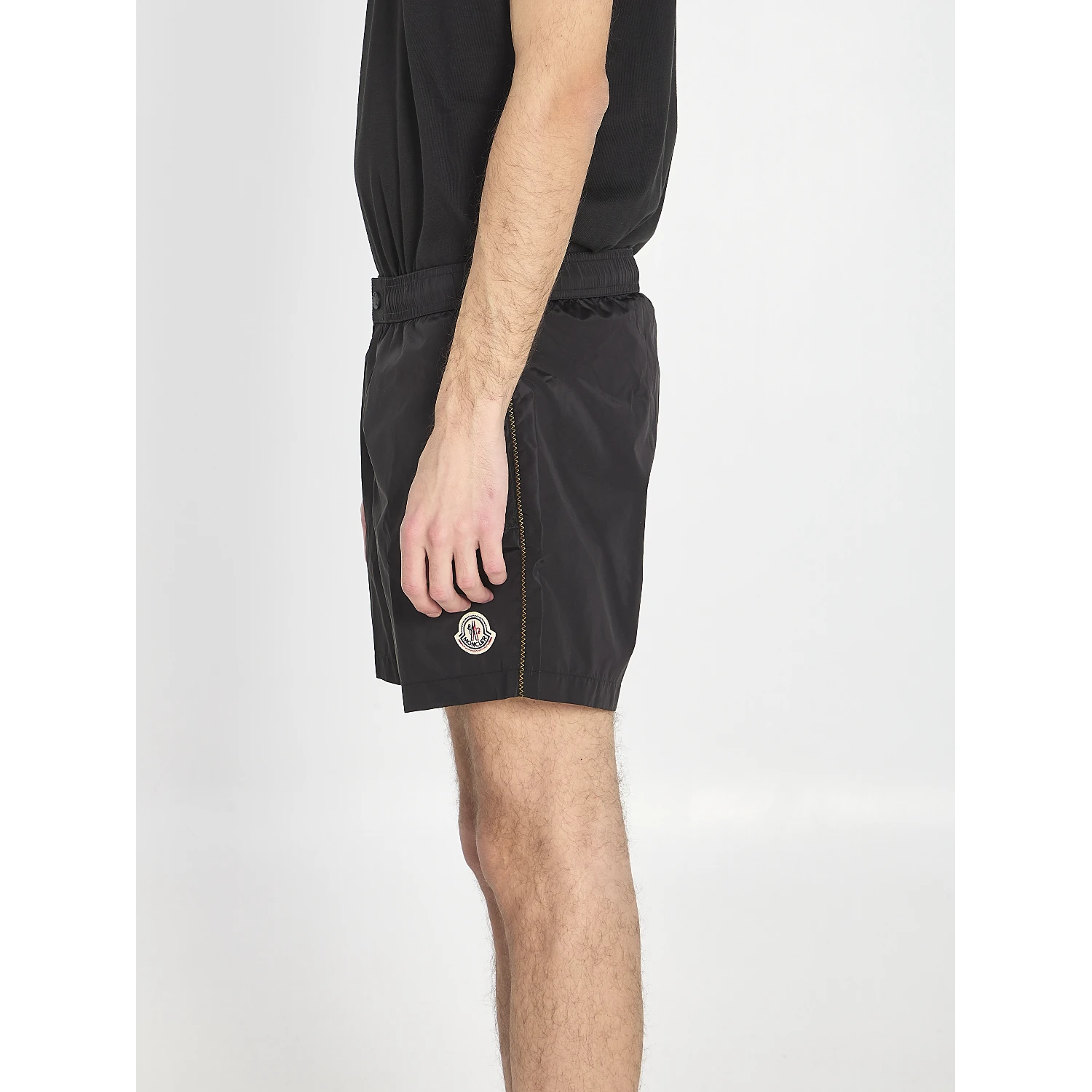 Swim shorts with a logo patch