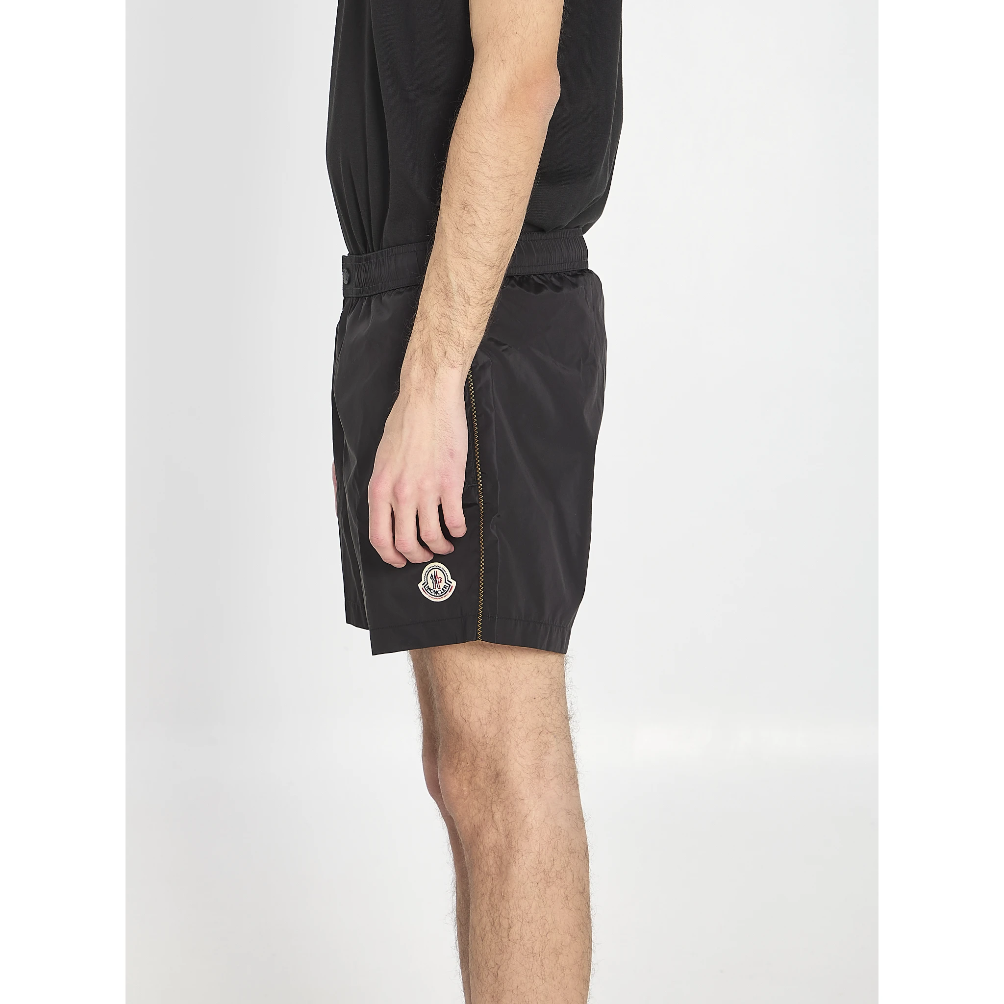 Swim shorts with a logo patch