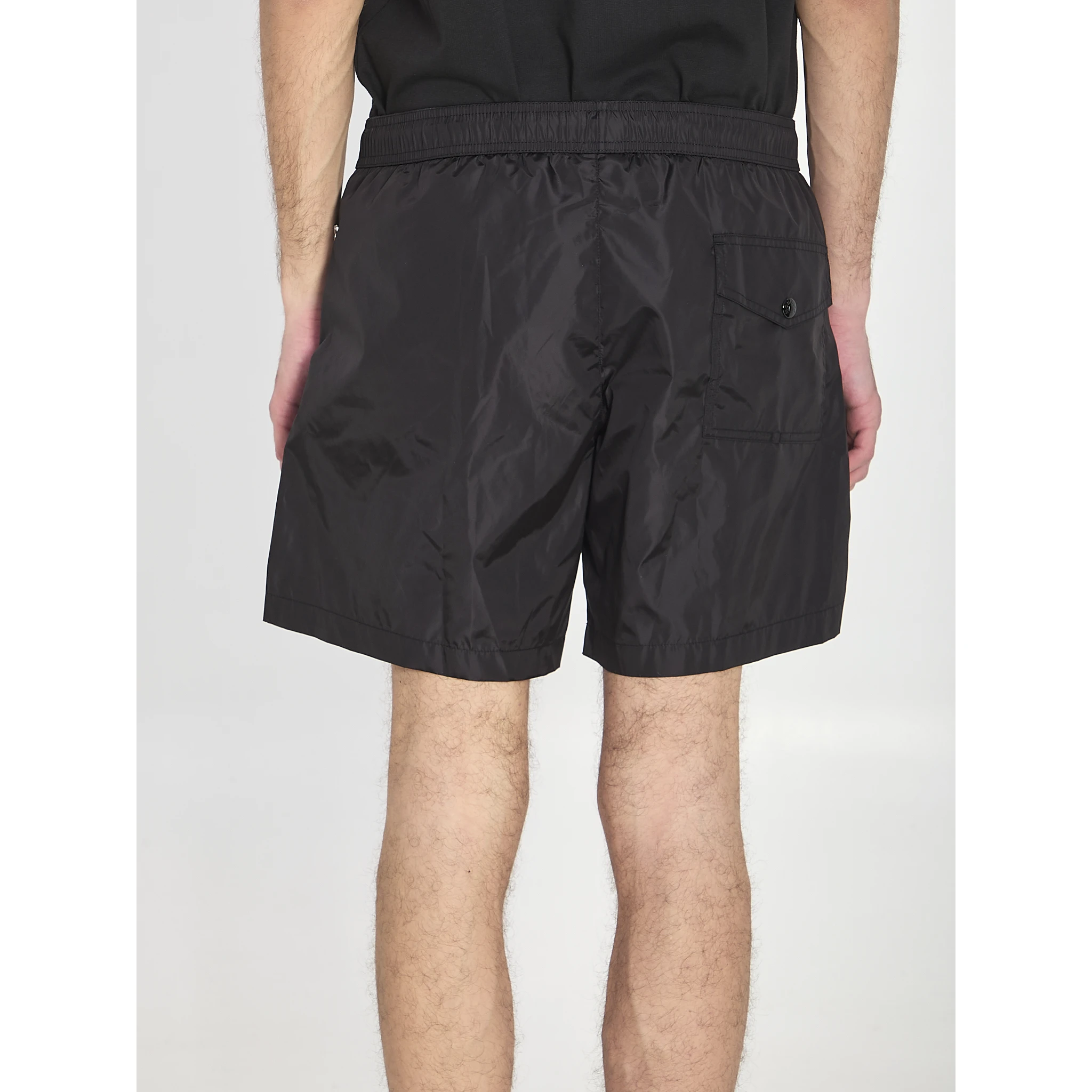 Swim shorts with a logo patch
