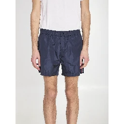 Swim shorts with a logo patch