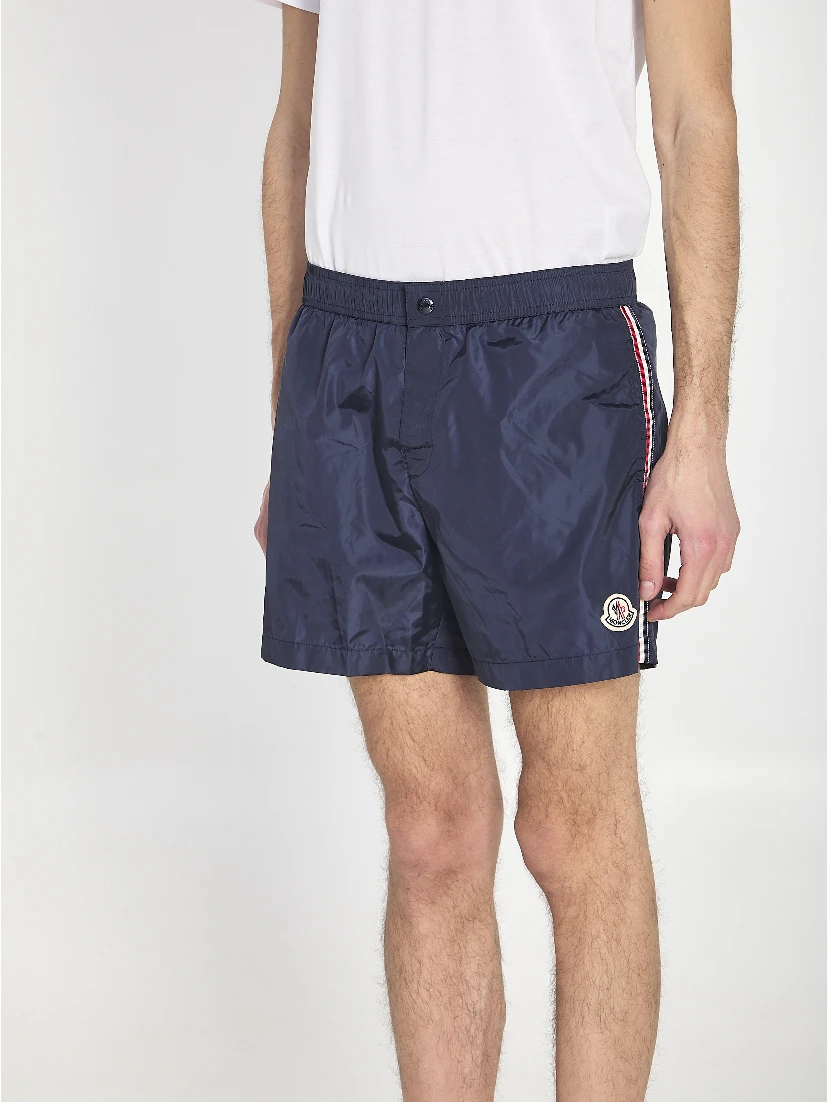 Swim shorts with a logo patch